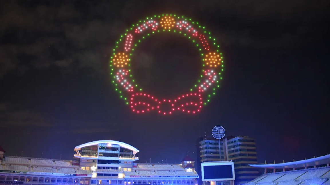 Drones forming the coloured pattern of a Christmas wreath in the night sky over Trent Bridge cricket ground