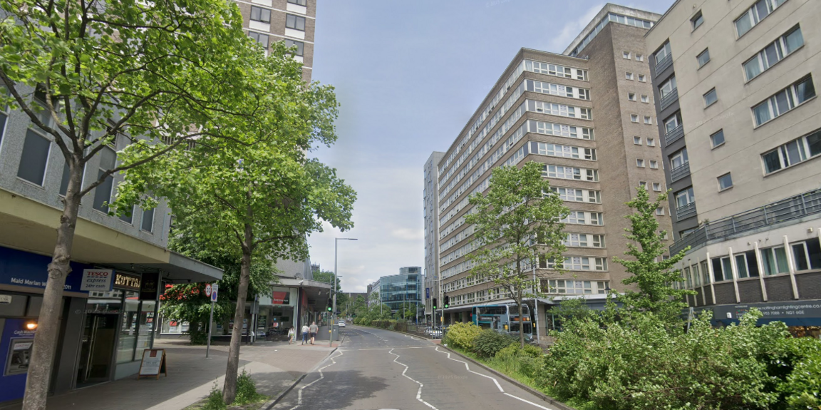Tall concrete buildings next to Maid Marian Way in Nottingham