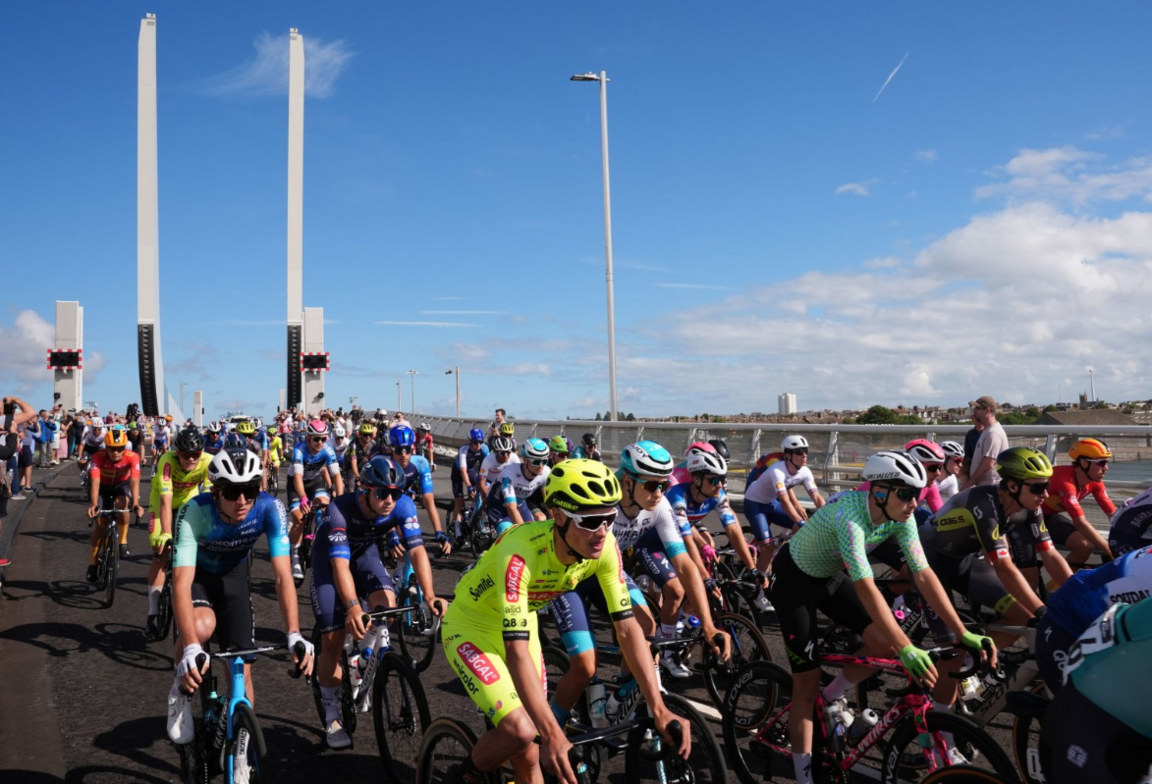 Cyclists in the Tour of Britain riding over the Gull Wing Bridge