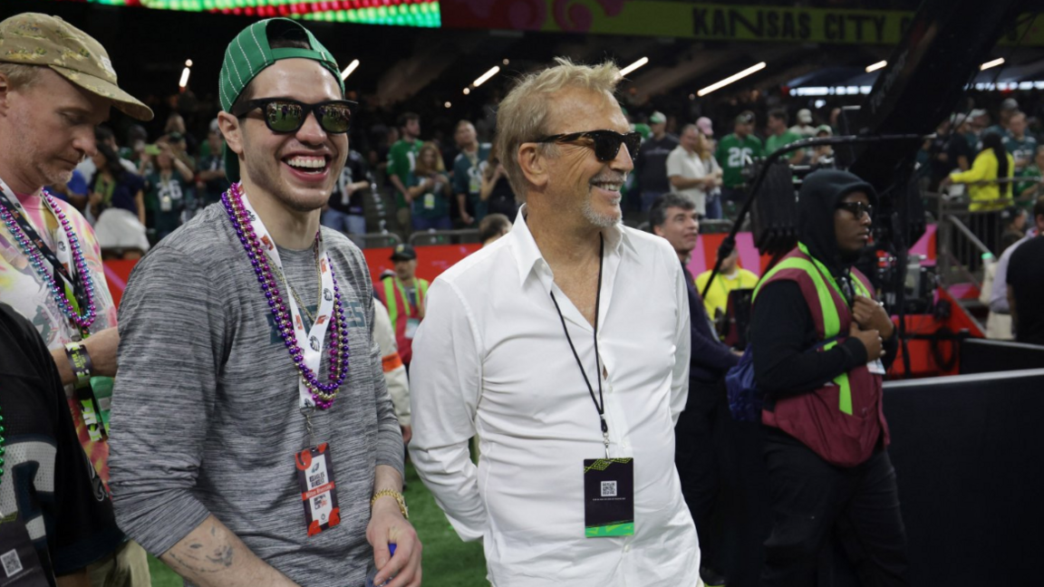 Actors Pete Davidson and Kevin Costner were spotted sharing a laugh ahead of the game kicking off