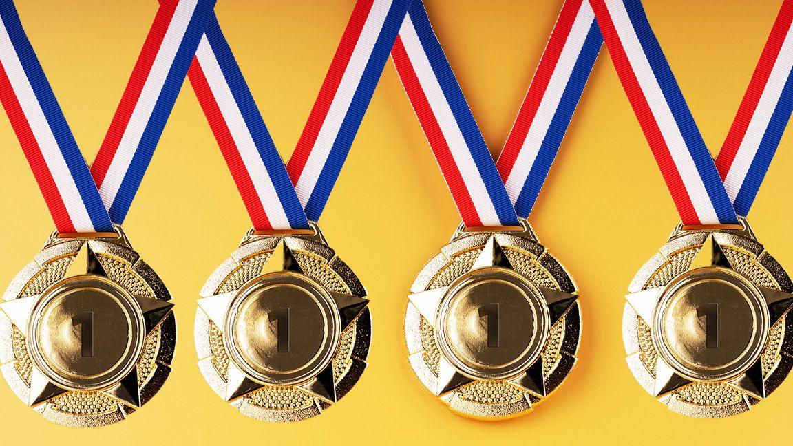 4 gold medals on a yellow background