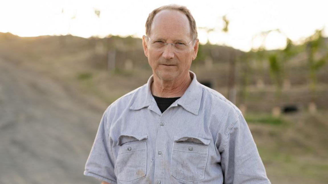 Winemaker Chris Howell standing in one of his vineyards in Napa Valley, California