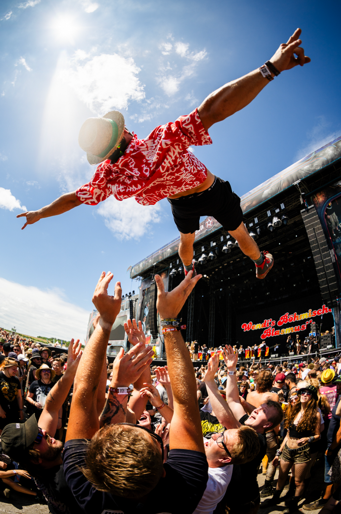 man being thrown above the crowd at the Nova Rock festival in Austria
