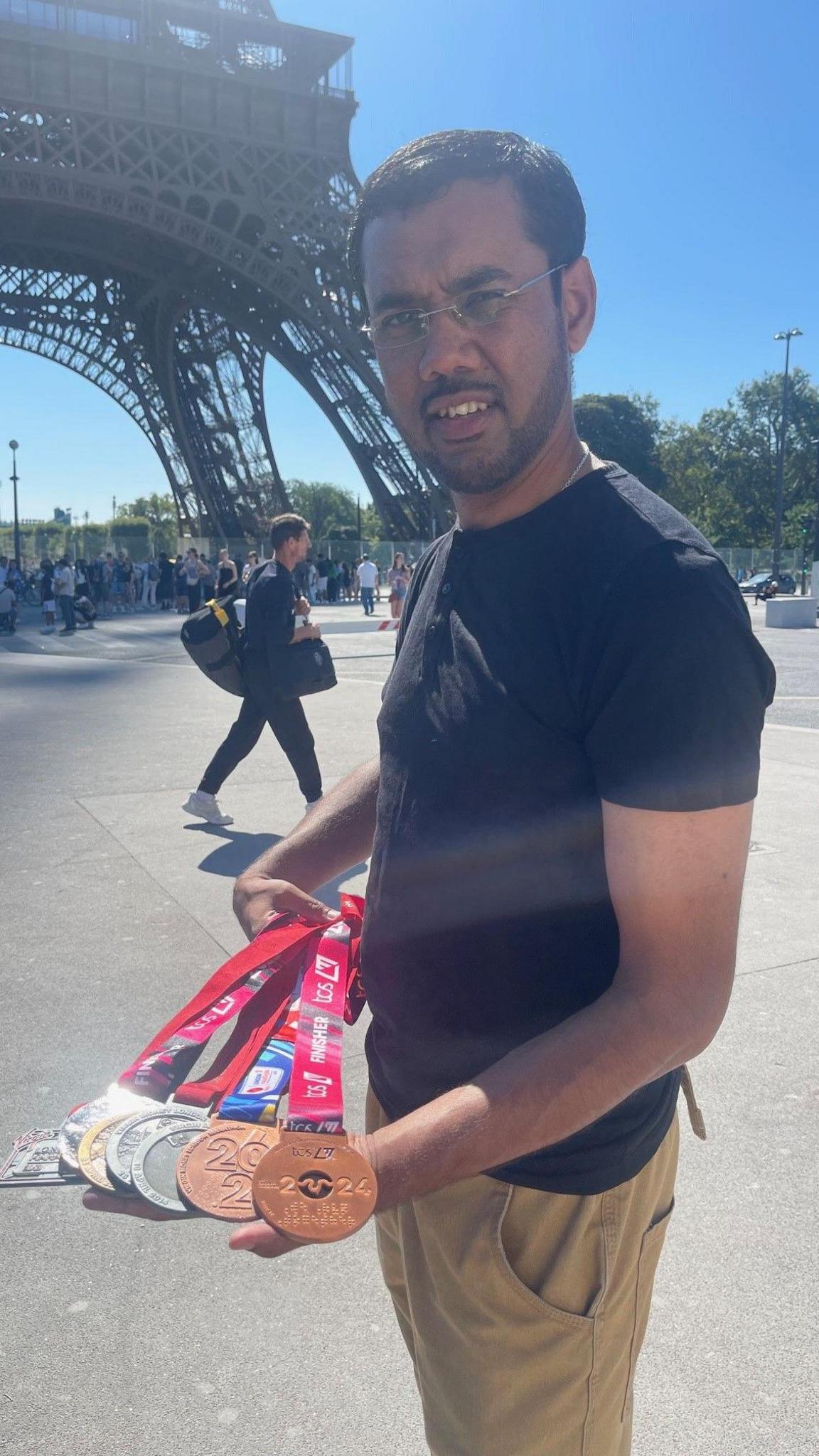  Mohammed with his London Marathon medals 