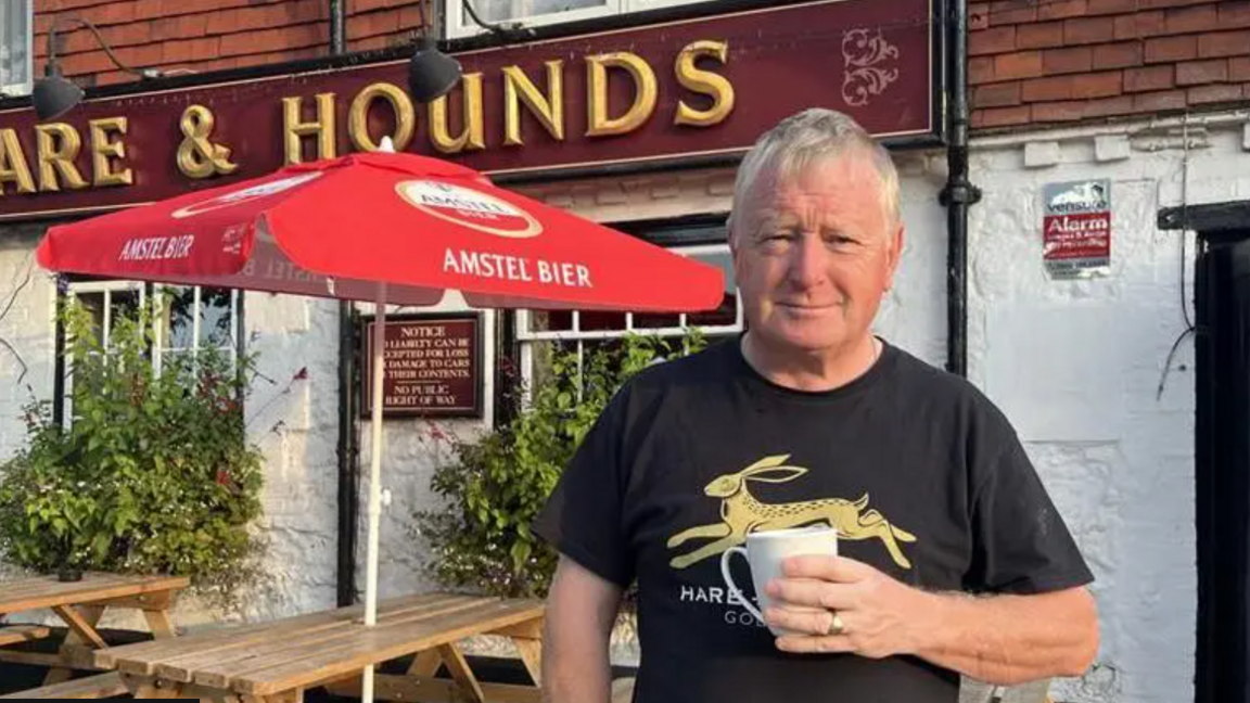 An image of Mark Cullinan, landlord of the Hare and Hounds in Godstone, outside his pub.