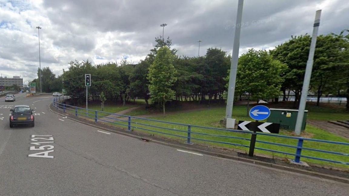 A generic image of Dartmouth Circus, showing cars on the left and trees and grass on the roundabout
