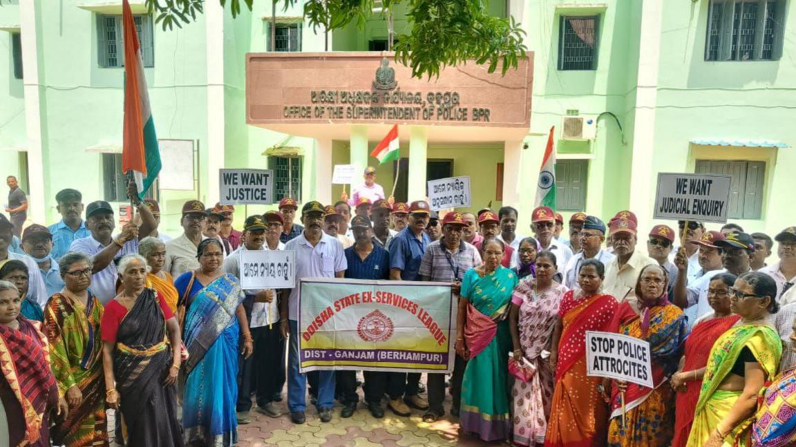 People gathered outside the police headquarters to protest against the alleged sexual assault of a woman in police custody.