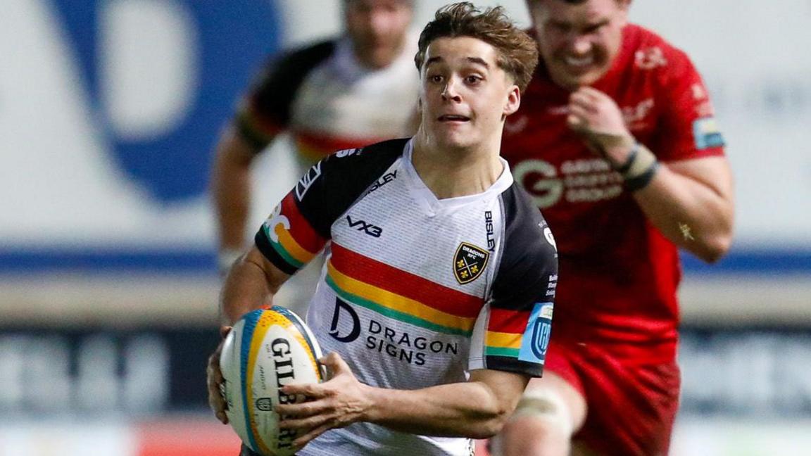 Dragons full-back Huw Anderson on the run against the Scarlets