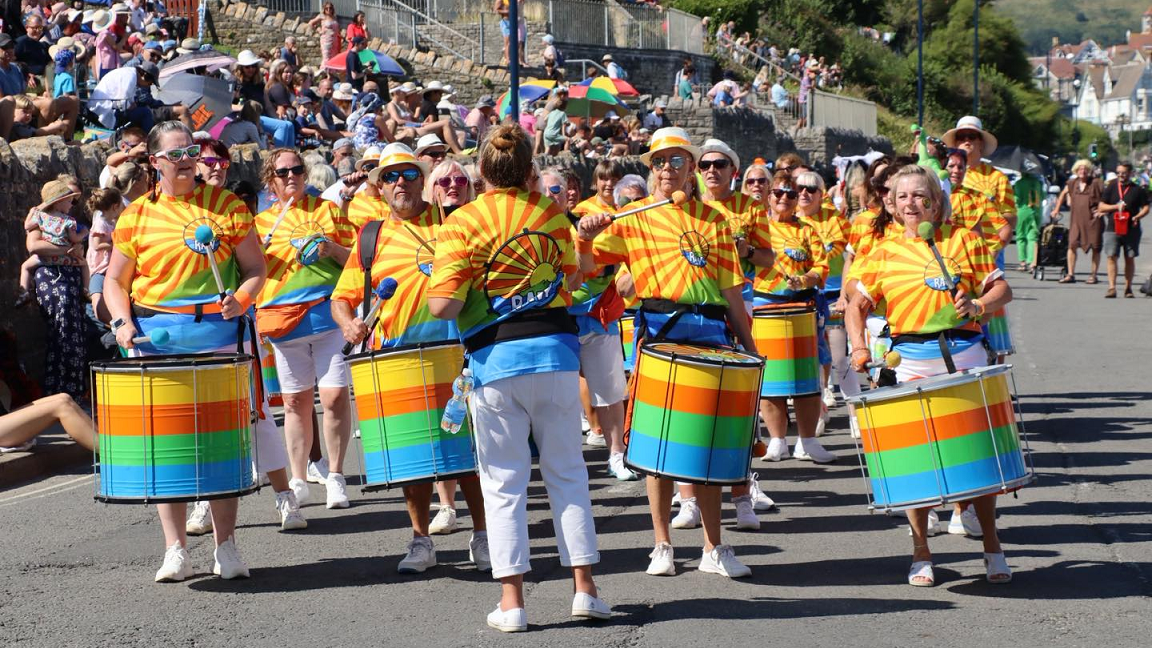 A group of people stood with drums forming part of the procession. 