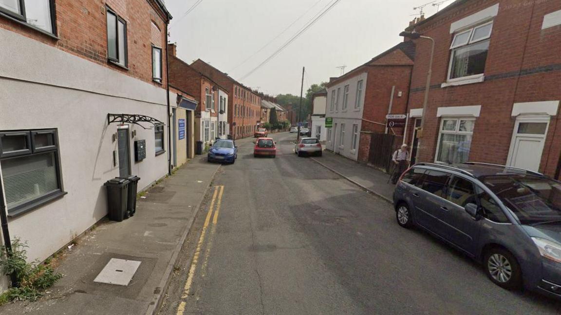 Urban street of two storey Victorian and more modern terraced houses