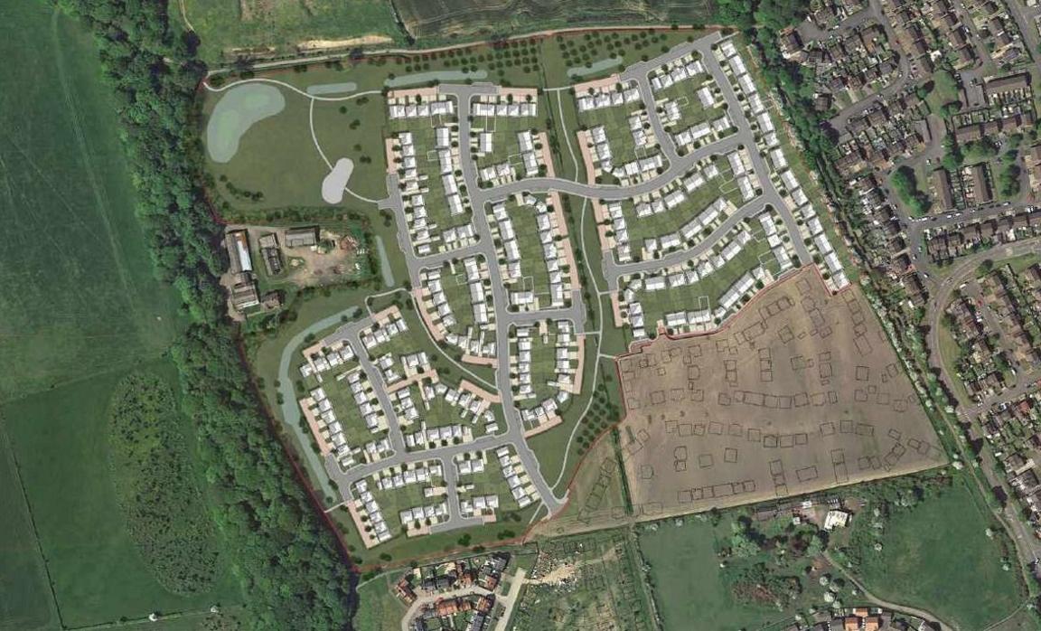 An aerial shot of the plot of the new housing development, surrounded by a number of existing houses, roads and green space. In the bottom right hand corner of the existing estate, lines mark the position of the proposed new-builds.