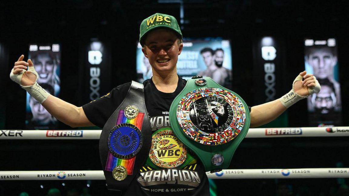 Francesca Hennessy poses with belts