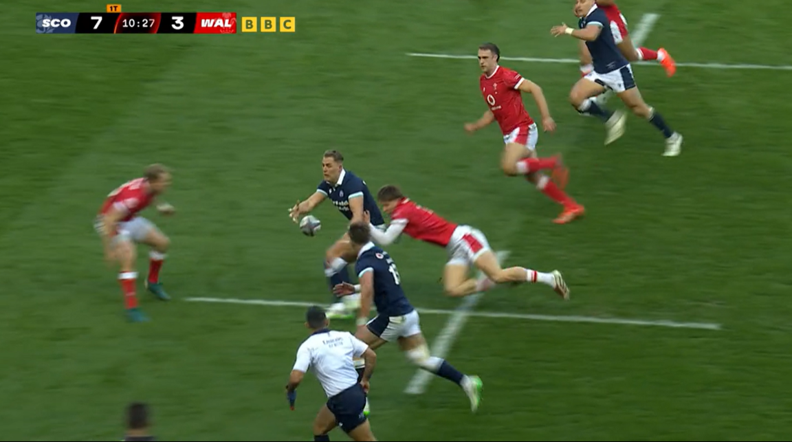 Duhan van der Merwe passes the ball wide for a Scotland try