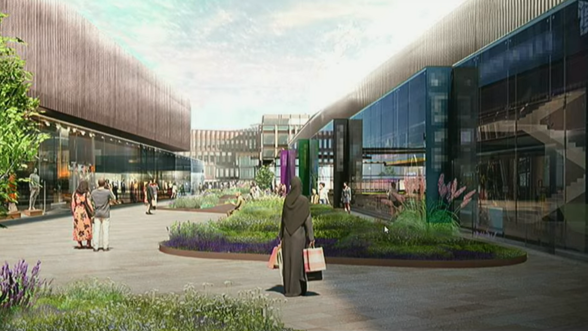 An artists drawing of a number of block-shaped buildings surrounding a paved area with some plants in the middle. CGI generated people on the paths include a woman with a black headscarf and black dress with her back to the camera, holding several bags. There is also a couple to the left of a flowerbed, holding hands.