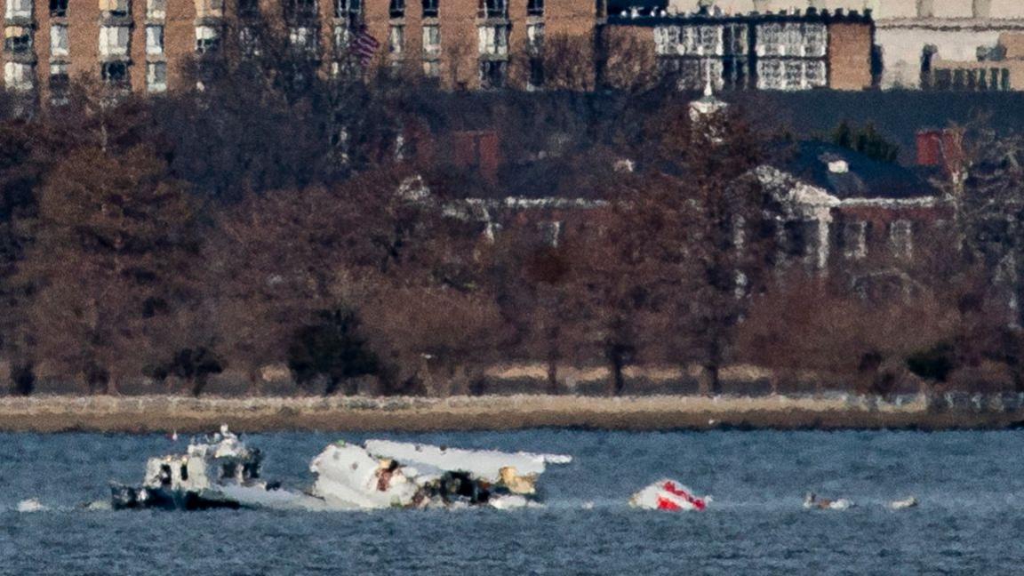 Emergency response units work at the crash site of the American Airlines plane on the Potomac River