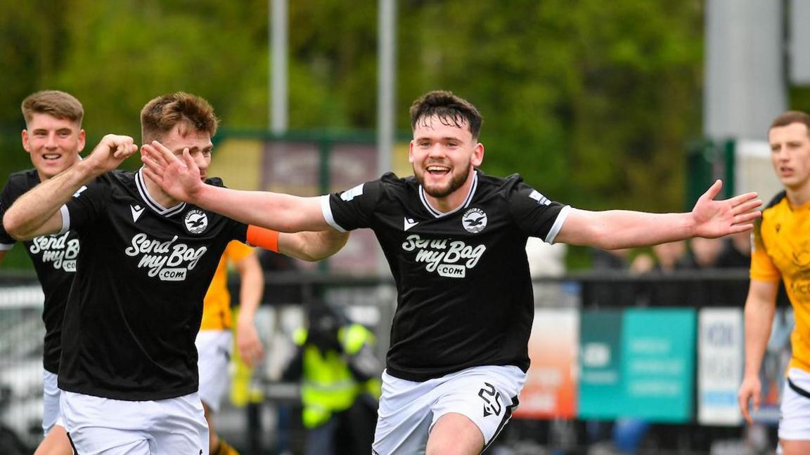 Michael Morgan celebrates scoring for Bangor