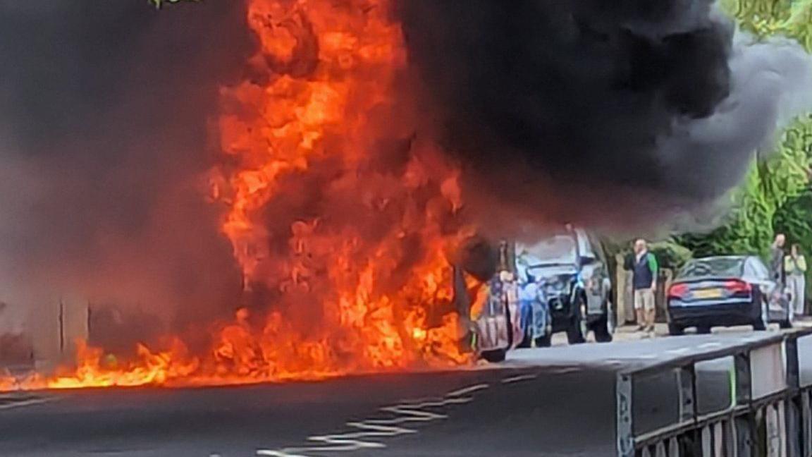 flames from bus on street