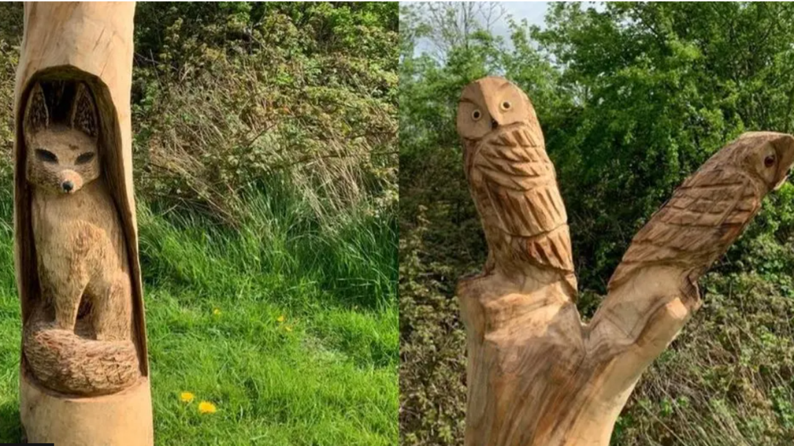 Wooden sculpture of a fox and two owls