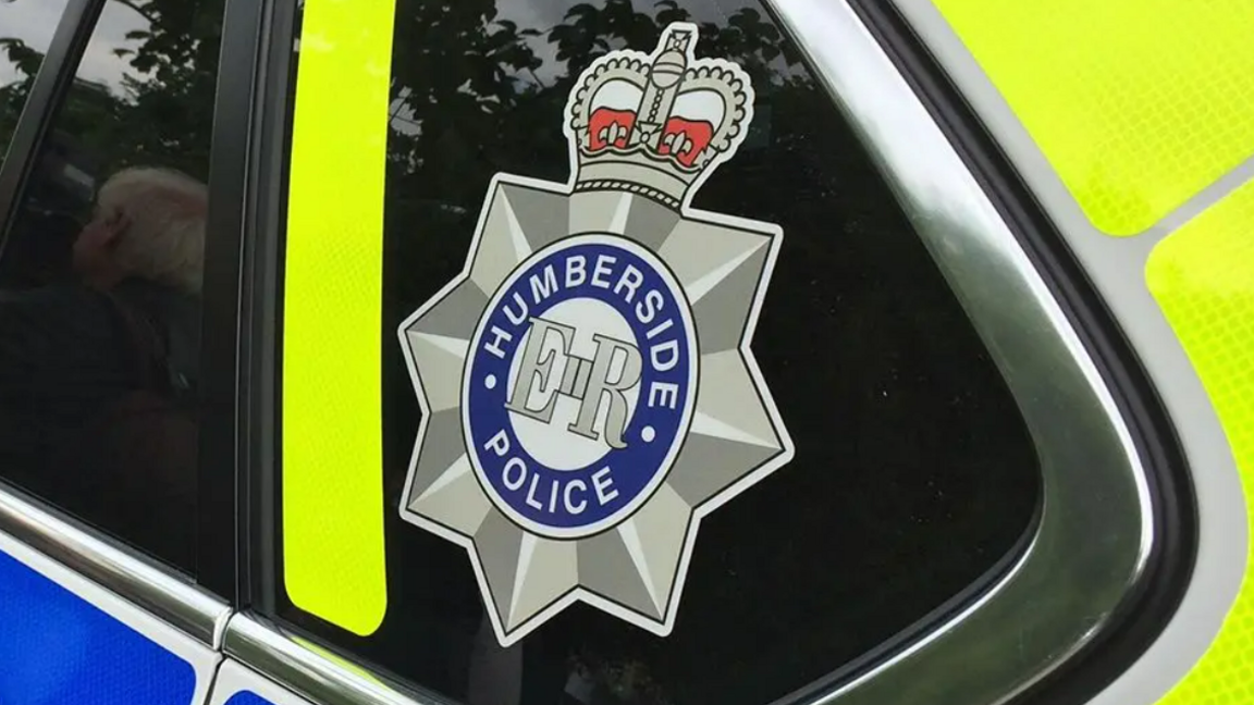 A close up of a police car with Humberside police logo.