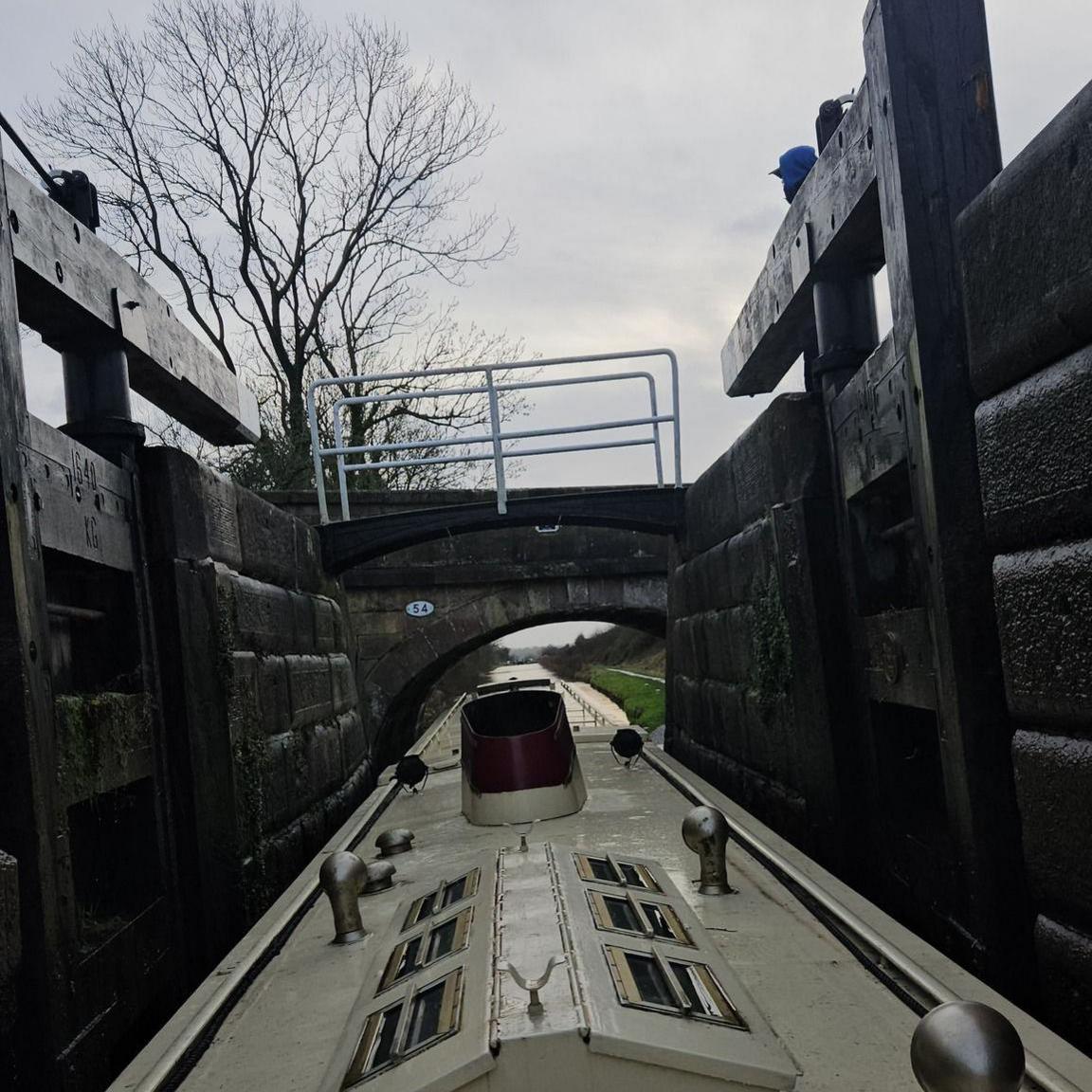 The narrowboat inside a lock