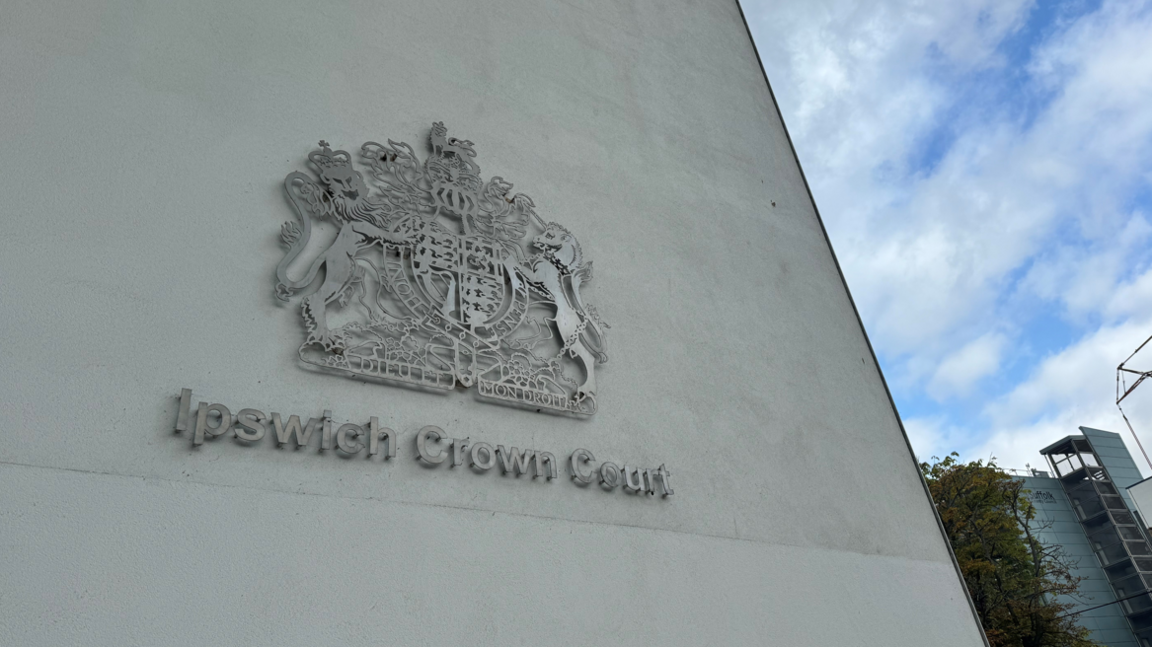 The Ipswich Crown Court logo on a concrete building