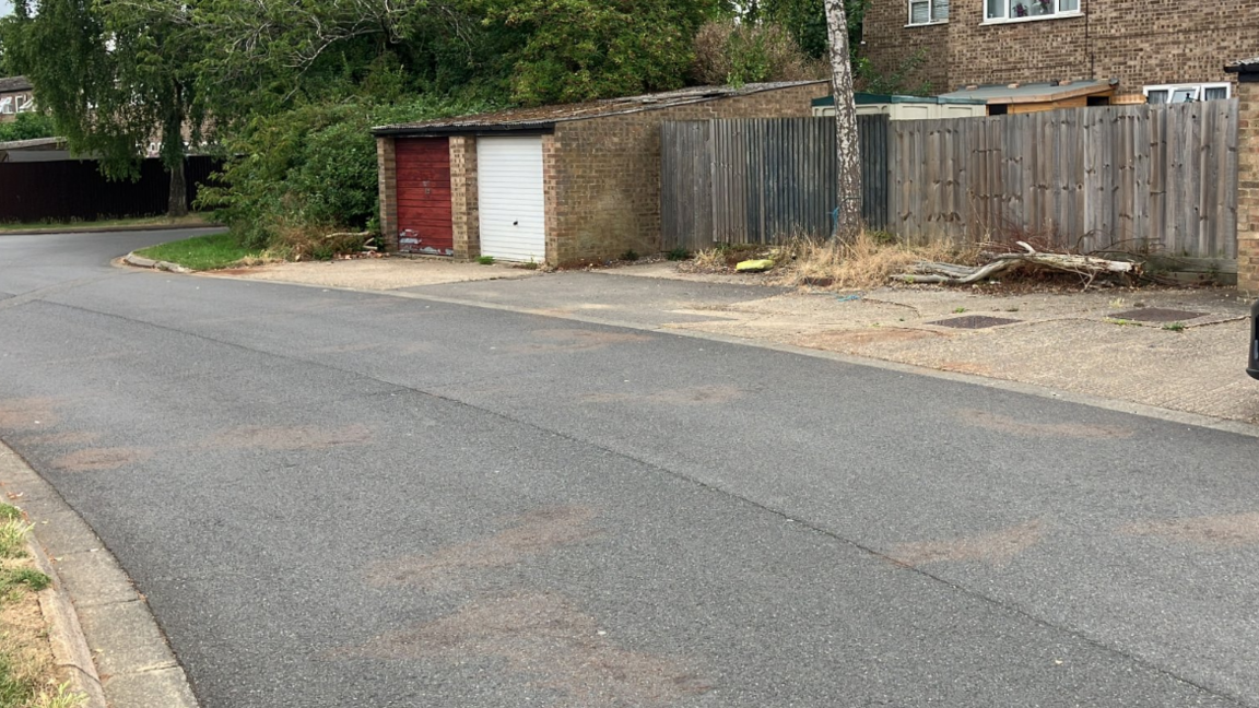 Blood stains on the road at the site of the attack in Watergall