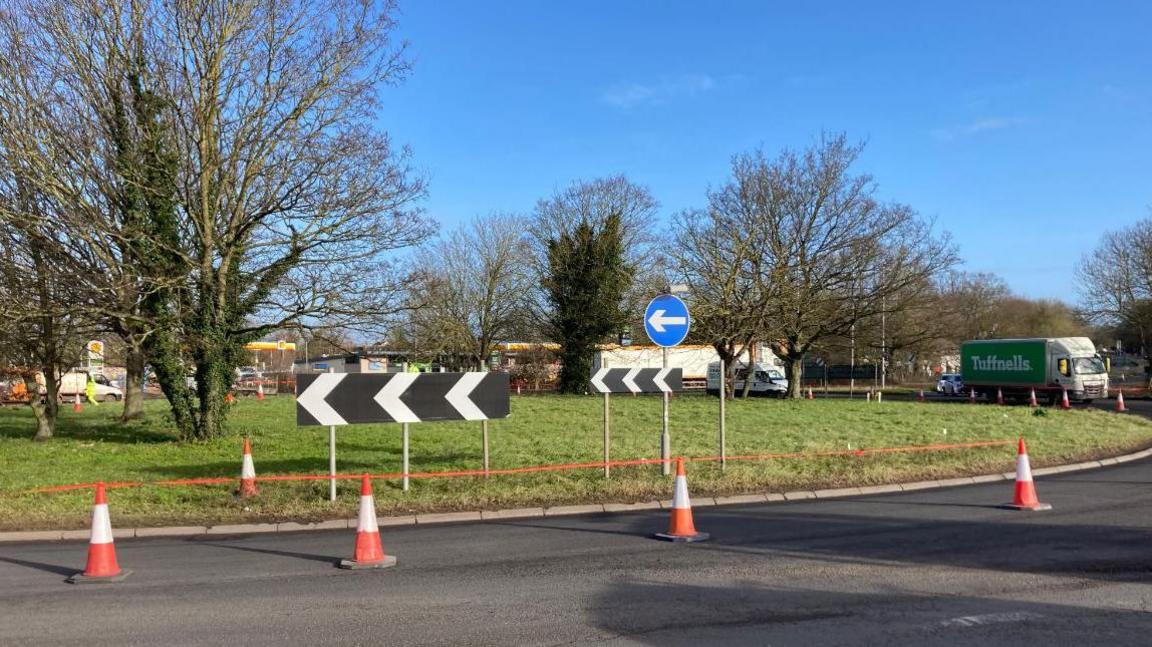 A roundabout with cones on it showing roadworks are going on 