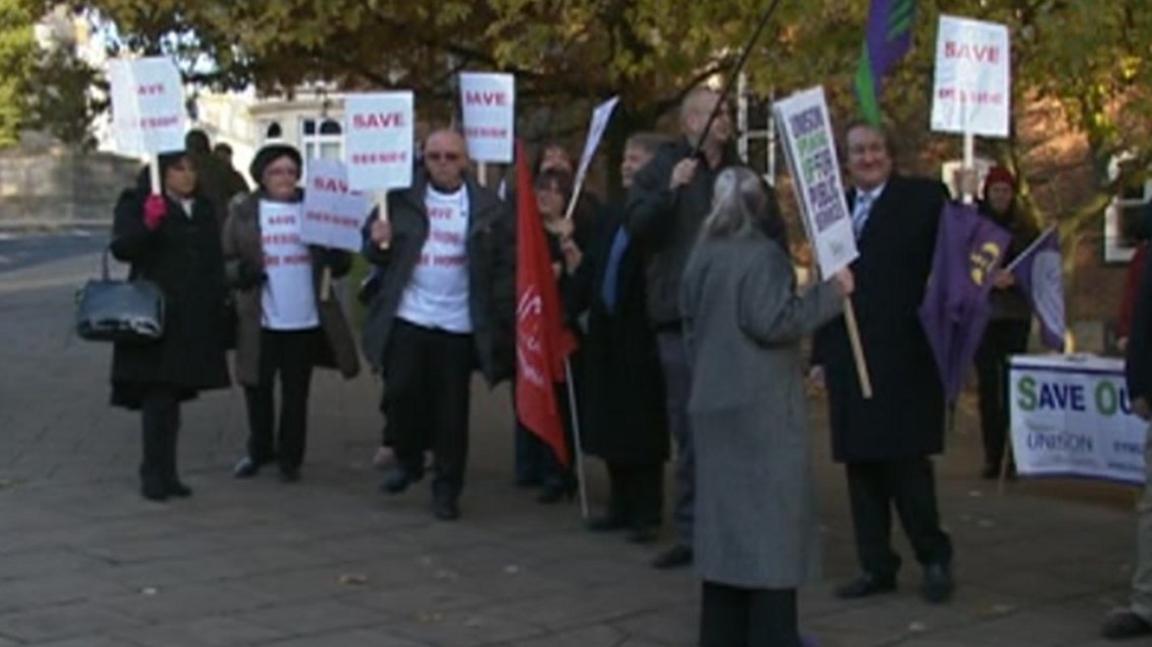 Campaigners picketing against the closures