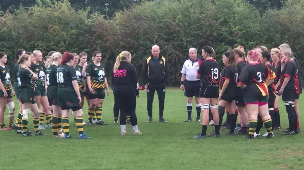 Image of two female rugby teams playing a match