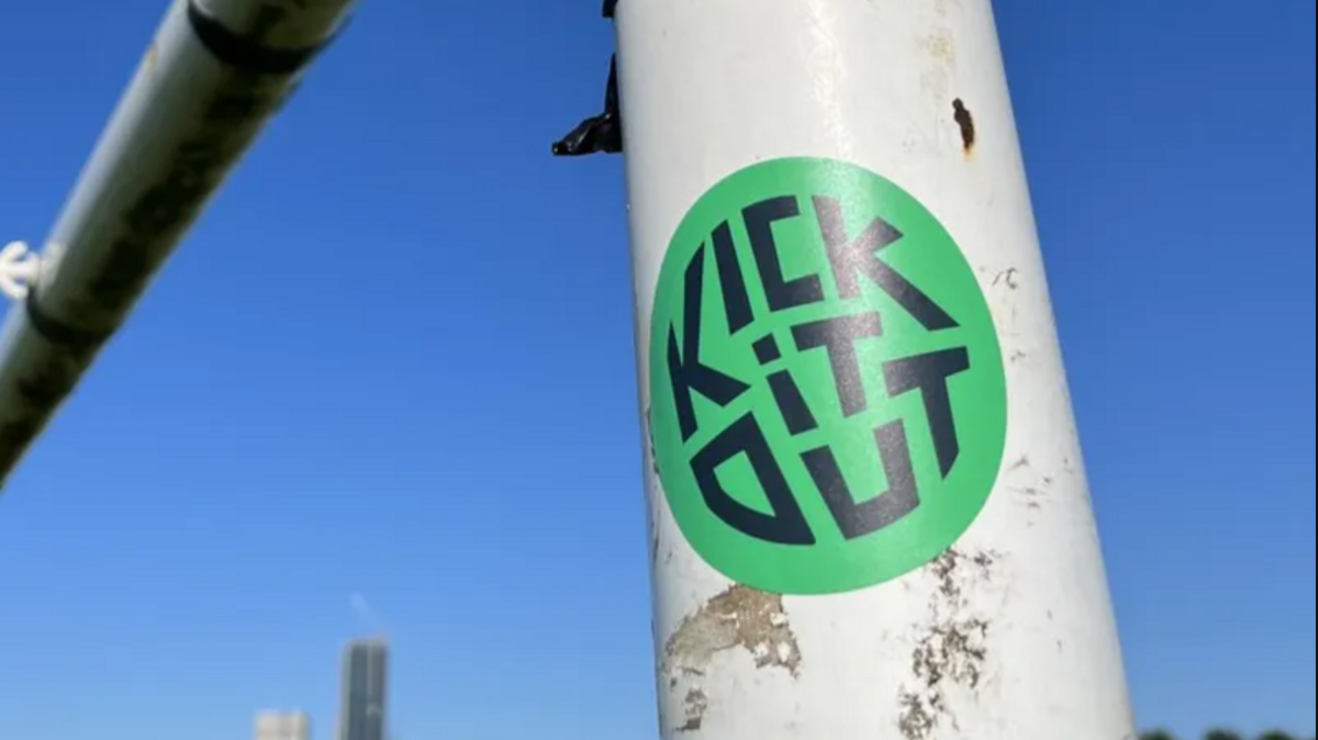 Kick It Out sticker on a goalpost