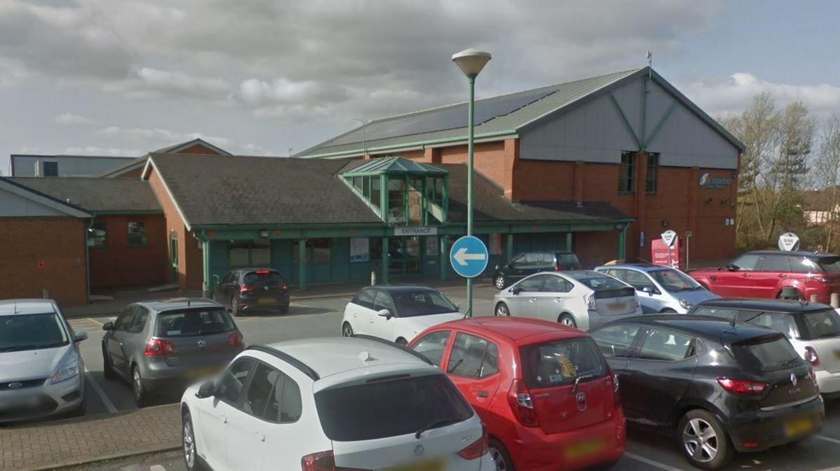 General view of Springwood Leisure Centre in Derby with cars in car park