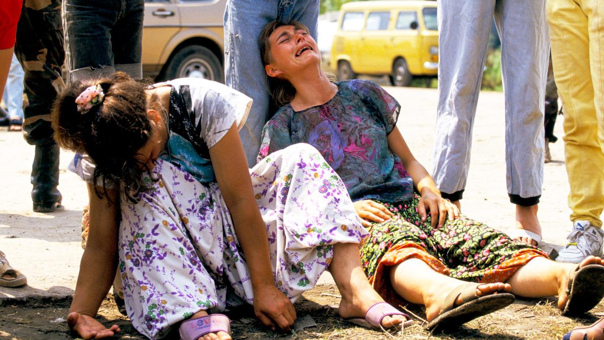 Exhausted and emotional refugees from Srebrenica arriving at a camp in Tuzla, July 1995