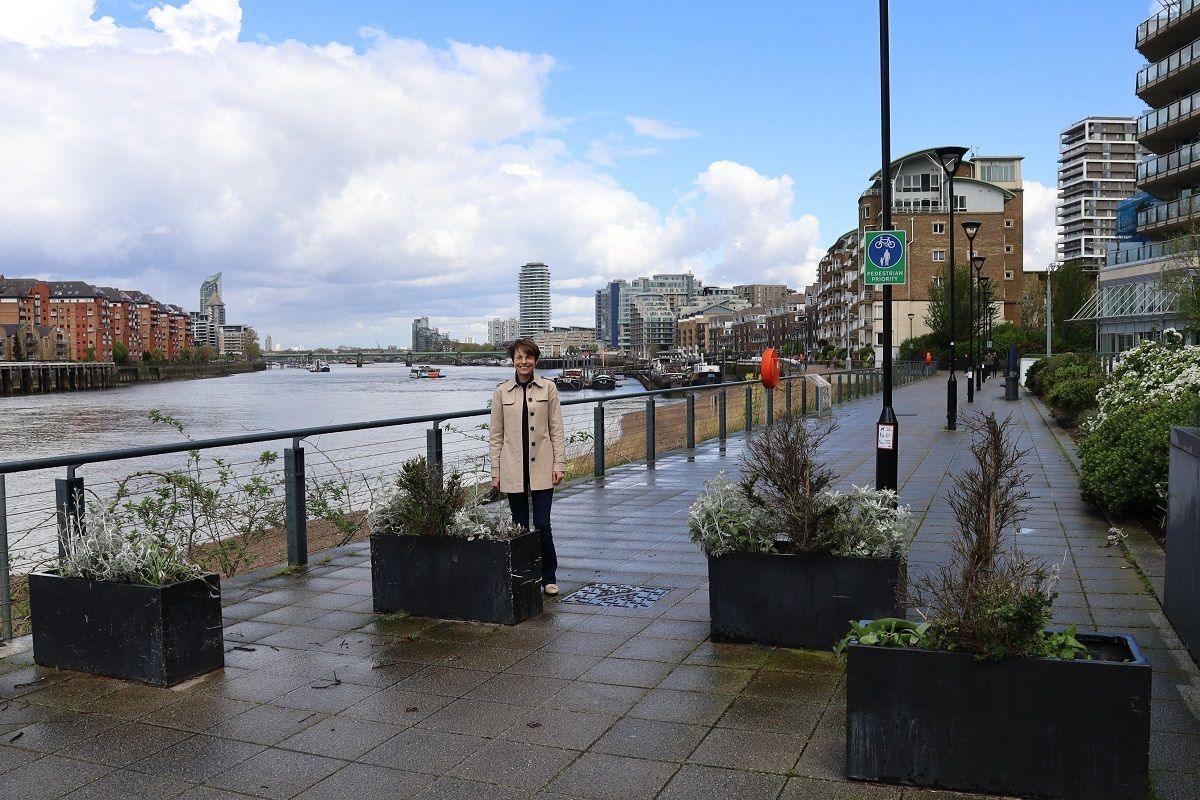 Labour councillor Jenny Yates on the Thames Path next to existing planter box arrangements designed to slow bicycle speeds.