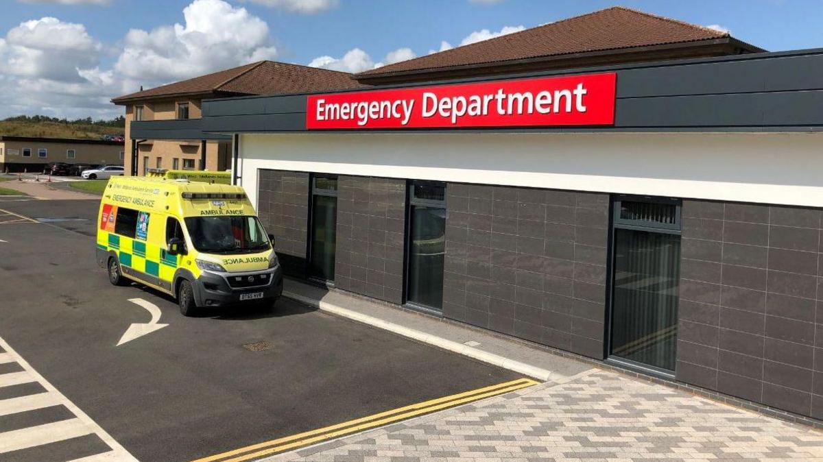 Entrance of A&E department in Telford with an ambulance parked outside on the left