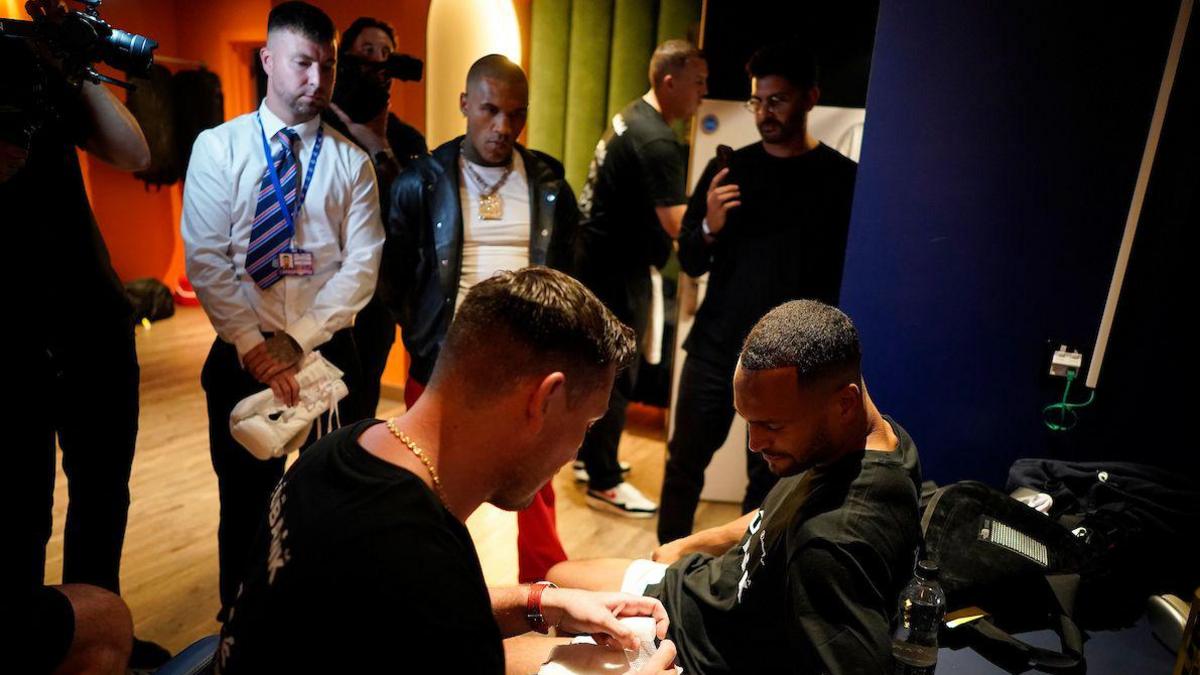 Conor Benn looking on at Harlem Eubank in the dressing room