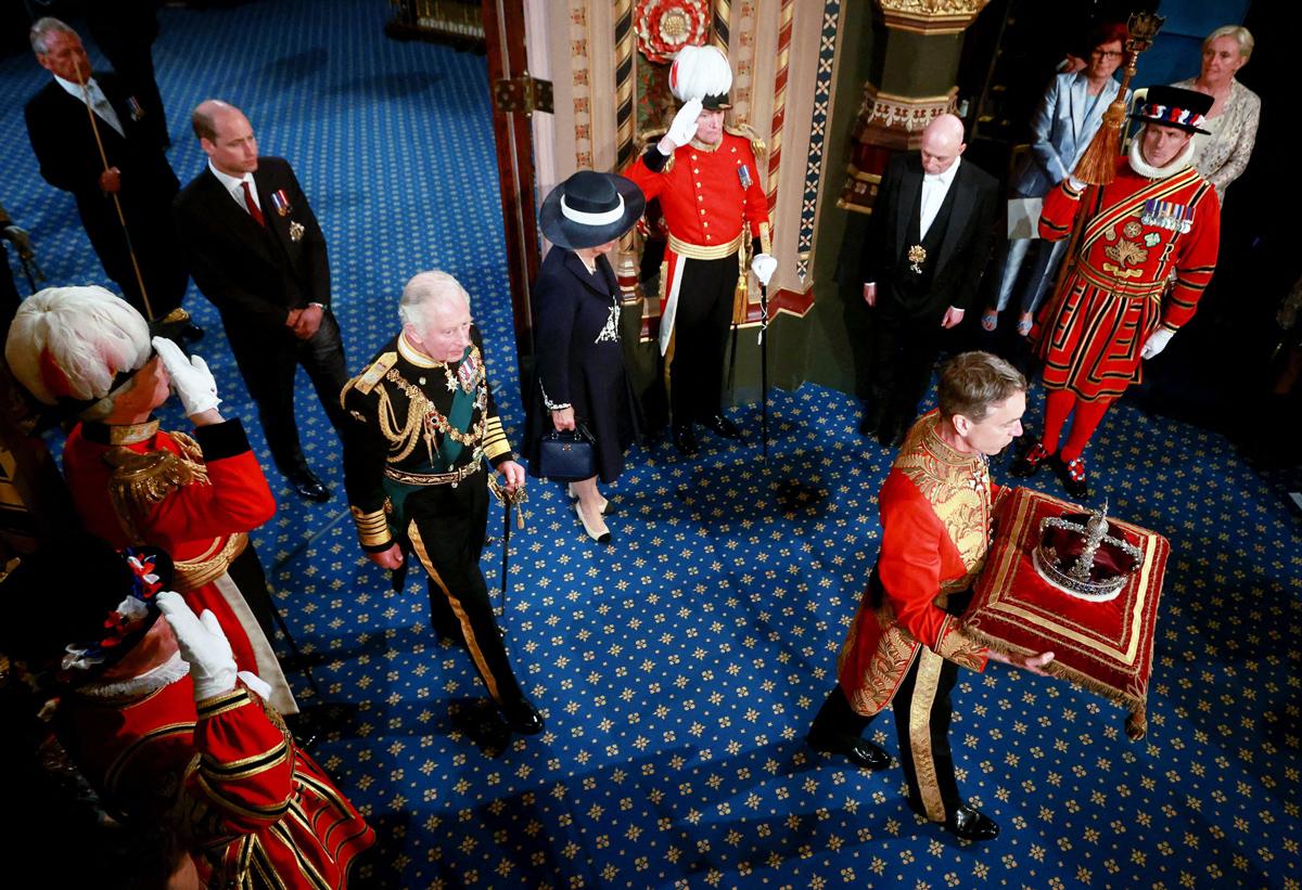 King Charles - as Prince of Wales - followed the Imperial State Crown through the Royal Gallery after delivering the Queen's Speech during the State Opening of Parliament in London, on May 10 2022.