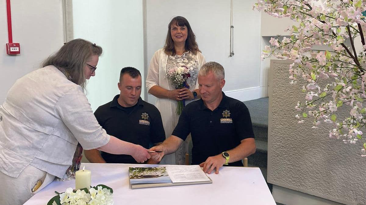 Martin Giles and Andy Brier being witnesses at David Martin and Rebekah Hill's wedding