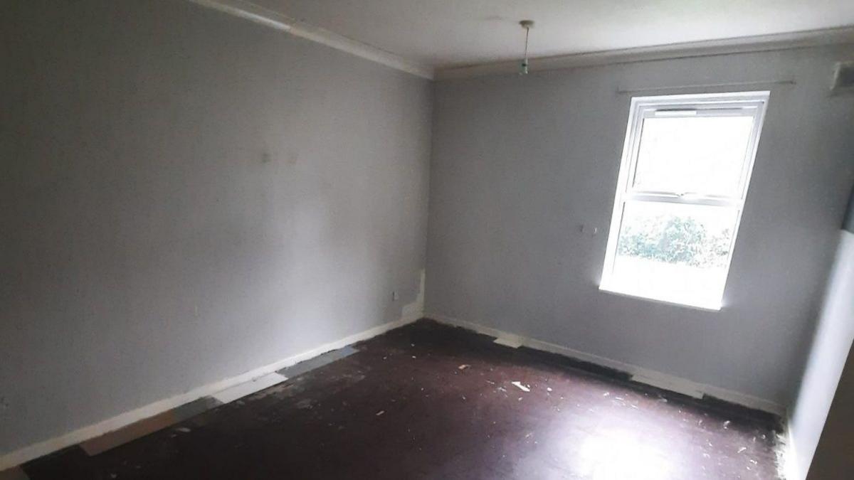 An empty room in a Wiltshire based social housing property with no carpet/floor covering or curtains/window covering