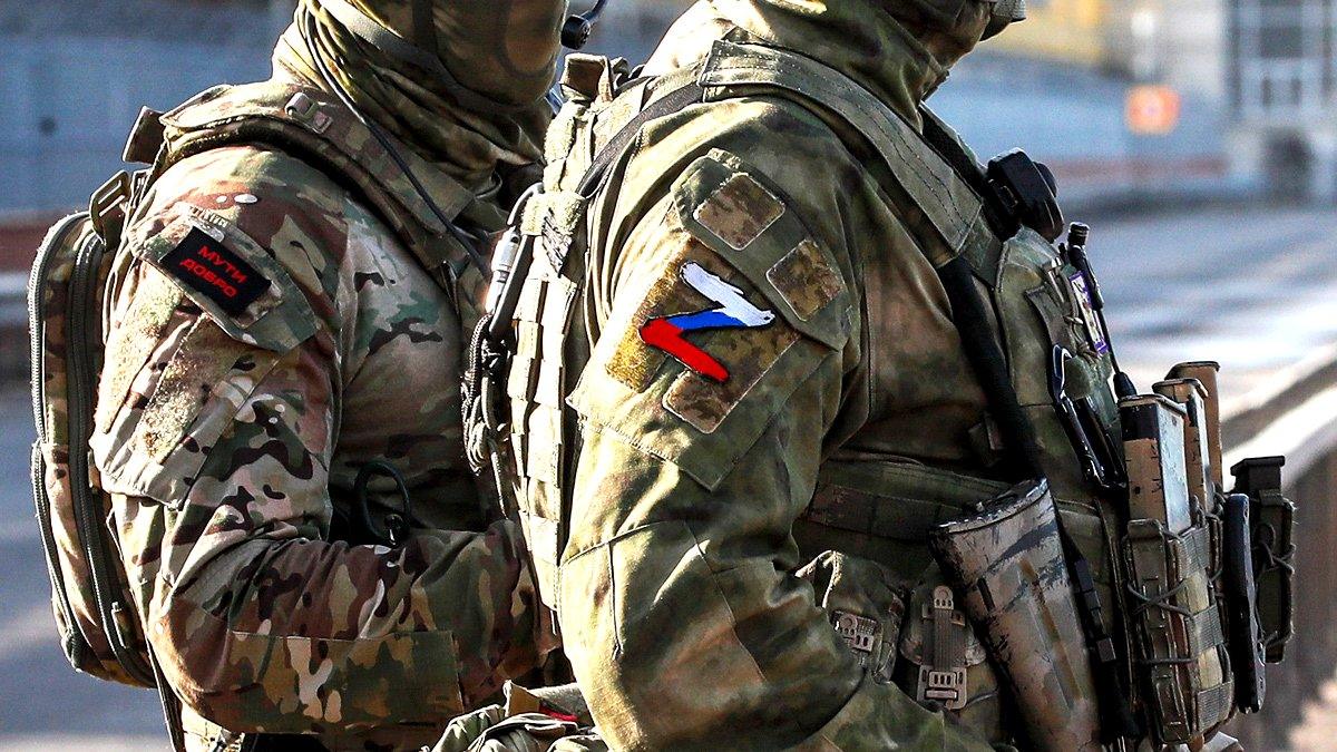 Russian servicemen stand guard near the Kakhovka Hydroelectric Power Plant near Kherson, Ukraine - 20 May 2022