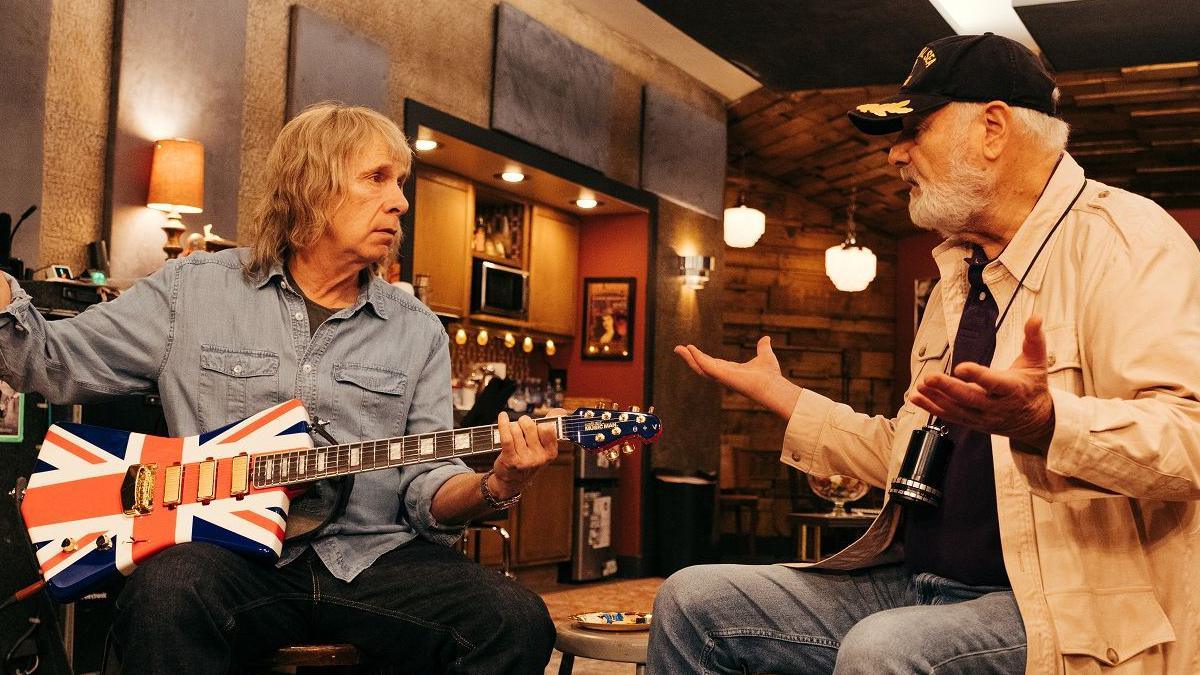 Marty DiBergi interviewing Nigel Tufnel playing a Union Flag guitar