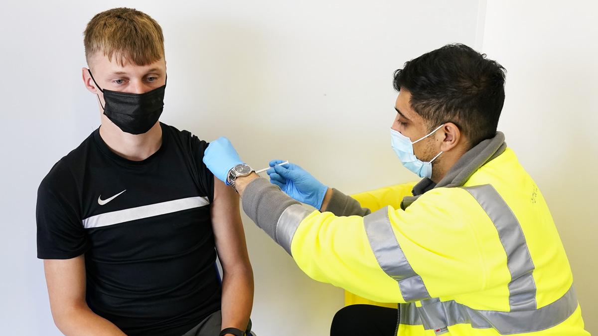 Young person being vaccinated