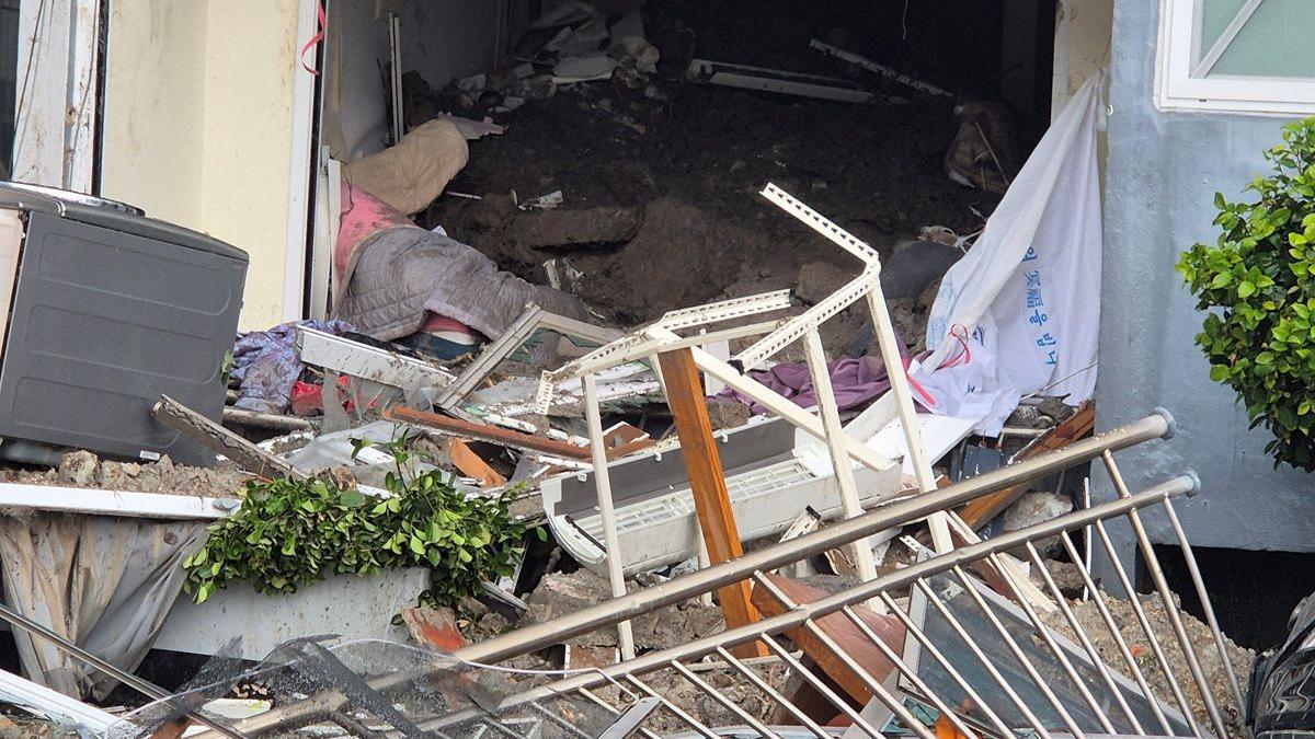 Debris is scattered after a landslide hits a housing unit