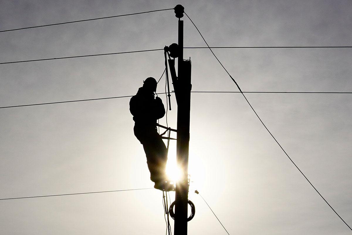 Engineer repairing power lines