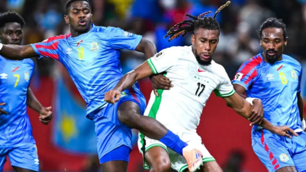 Dr Congo player challenging Nigeria's Chris Iwobi