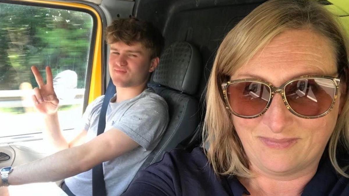 Karen Watt takes a selfie with her son Fynn, who is driving a van.