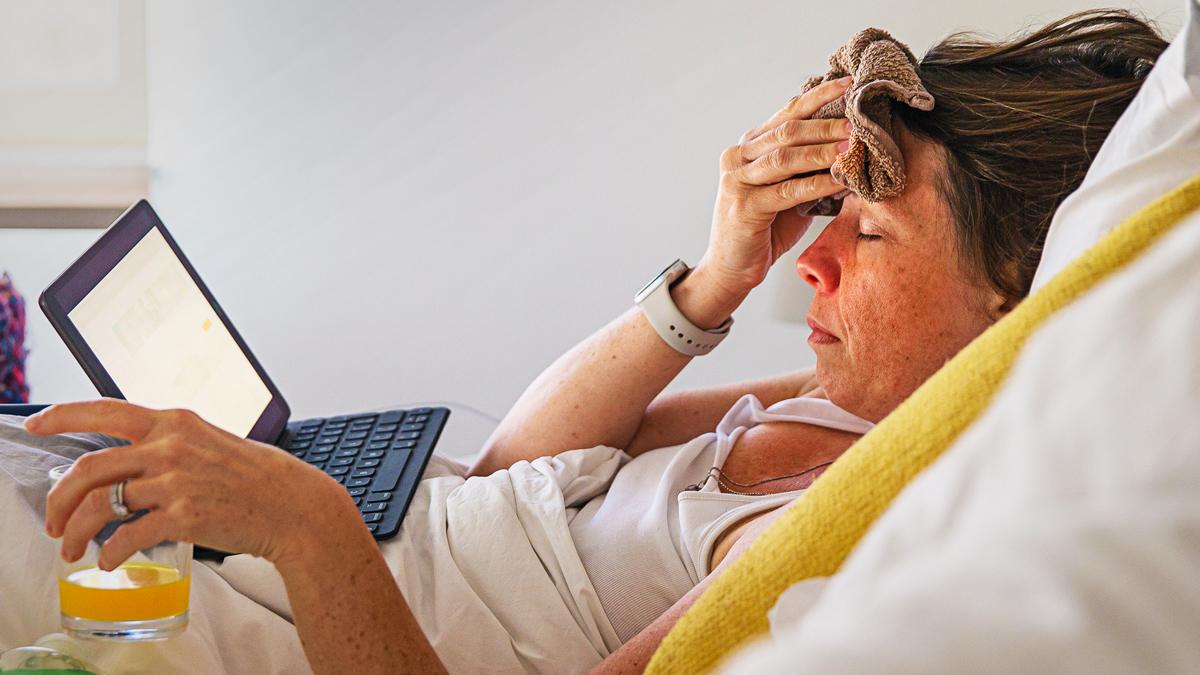 Woman in bed with flu