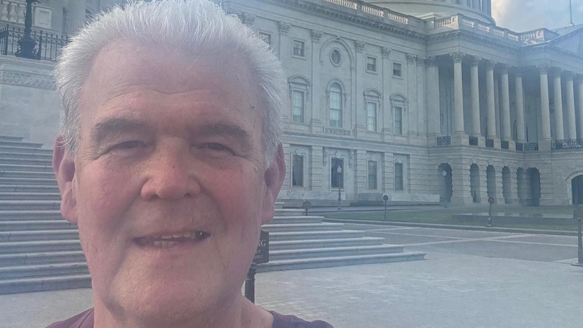 A selfie of Peter Ernest in Washington DC He has short, grey hair and is smiling at the camera.