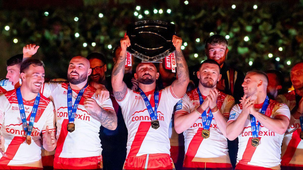 Hull Kingston Rovers captain Elliot Minchella lifts the League Leaders' Shield, surrounded by teammates