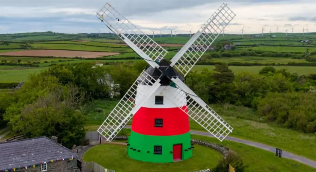 A windmill in the red, white and green colours of youth movement Urdd Gobaith Cymru