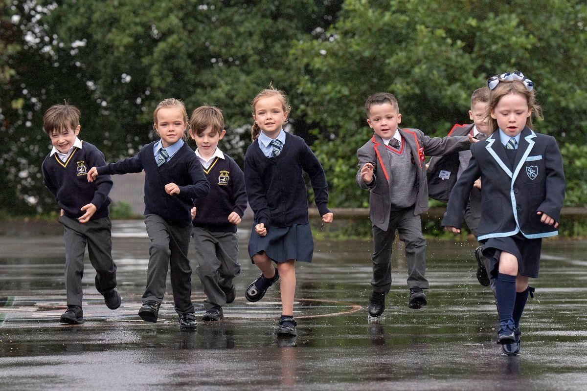 Twins running in playground.